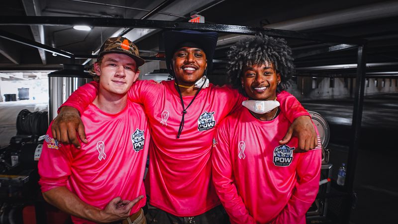 Members of the POW Pressure Washing crew